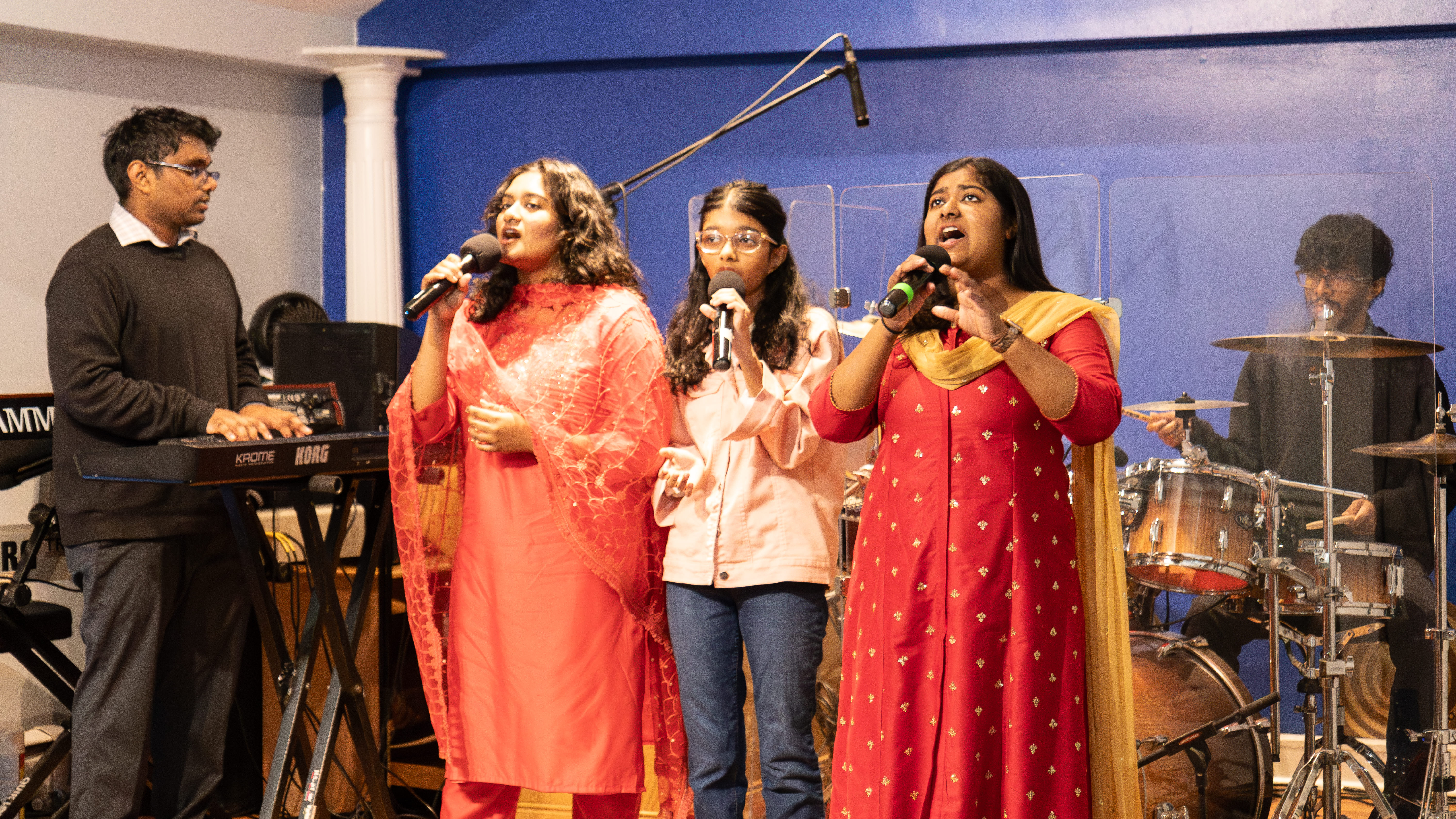 Congregation faithfully worshiping with bibles