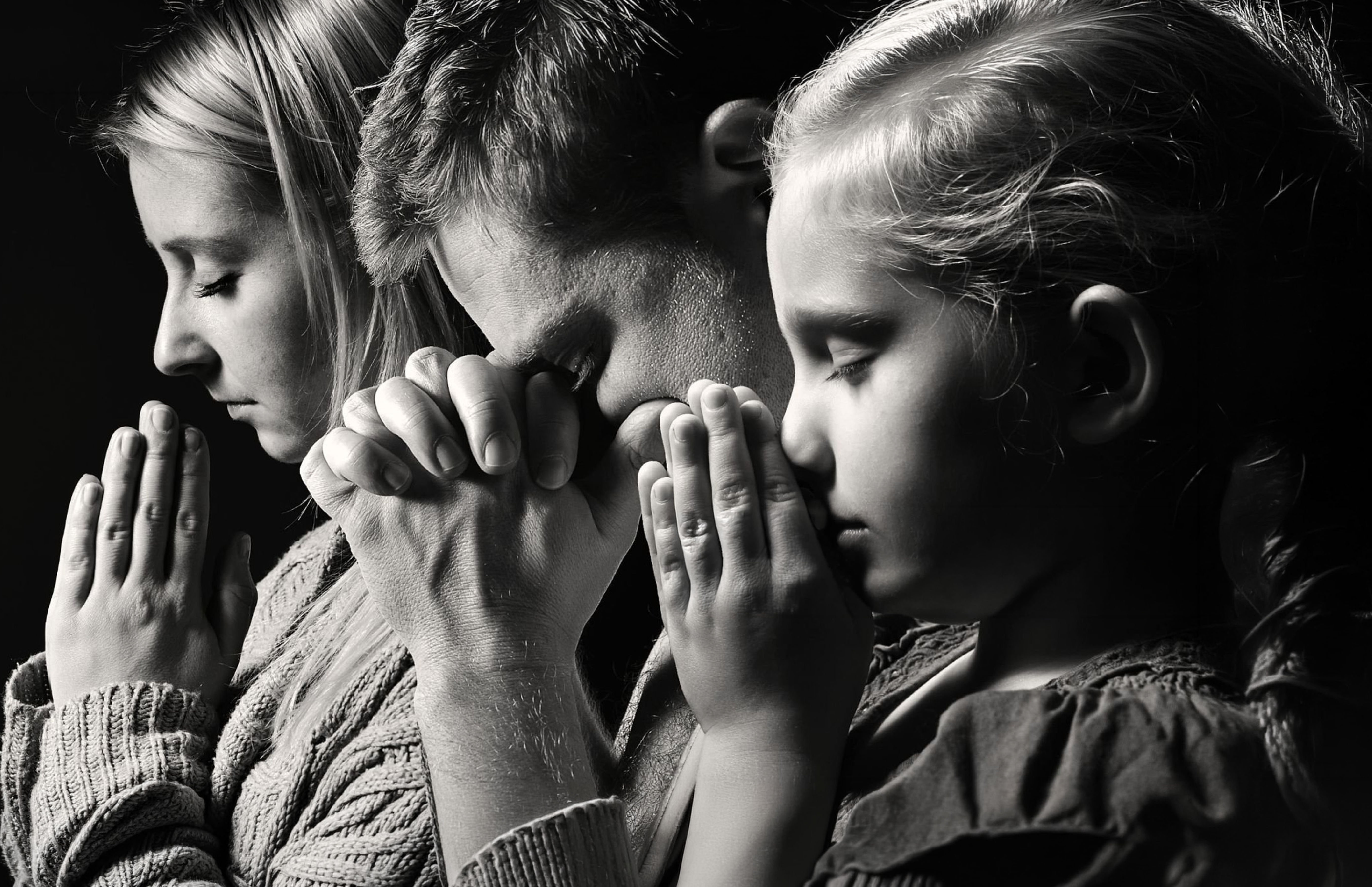 Family praying together